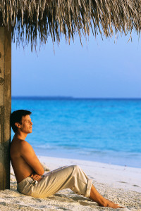 Man Relaxing on Sandy Beach